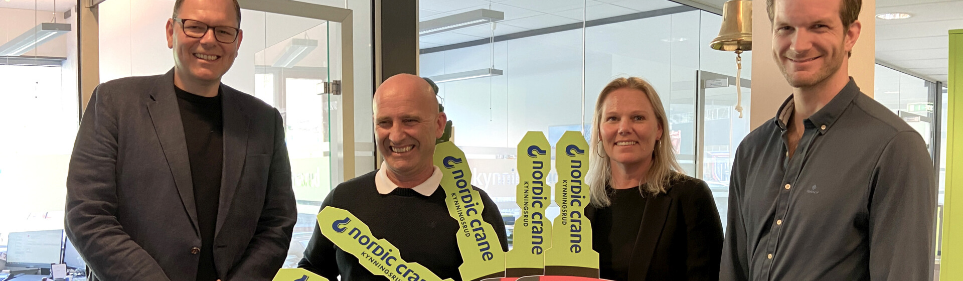 Smiles all round! Left to right are: Holger Haber, Manitowoc; Eirik Kynningsrud, Nordic Crane; Monika Øverby, ANK Cranes; Anders Kiel, ANK cranes. High five! Nordic Crane buys five Grove five-axle cranes (image 1)