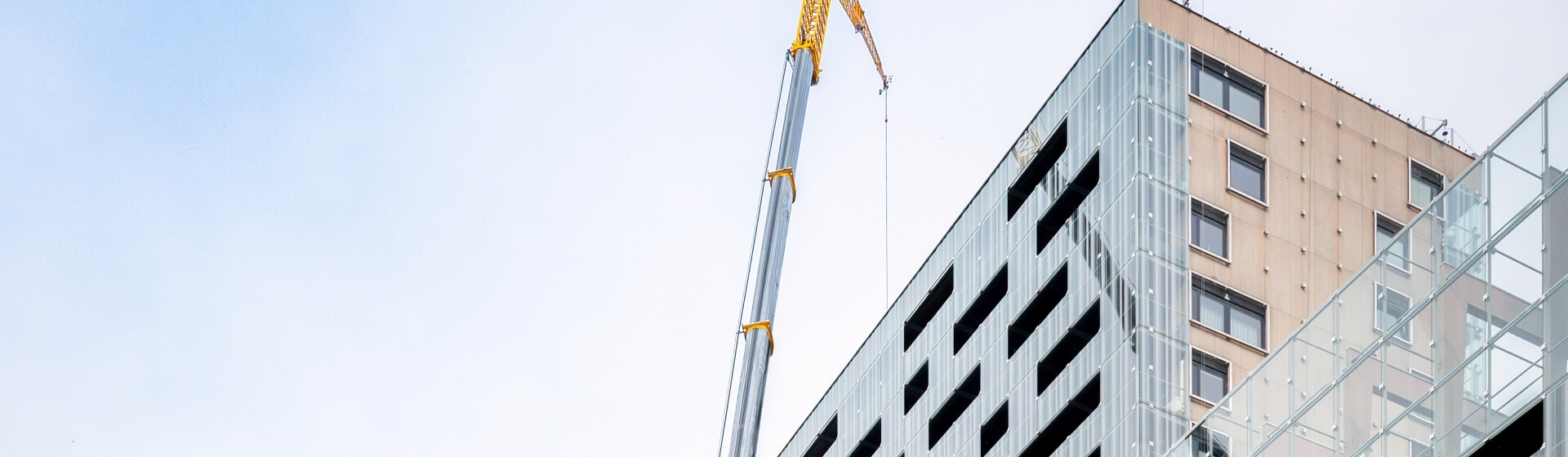 Kraanverhuur Boekestijn sent its Grove GMK6300L-1 all-terrain crane to Rotterdam to replace 750 windows in a downtown high-rise building. Grove-GMK6300L-1-proves-perfect-for-compact-jobsite-in-downtown-Rotterdam-01.jpg