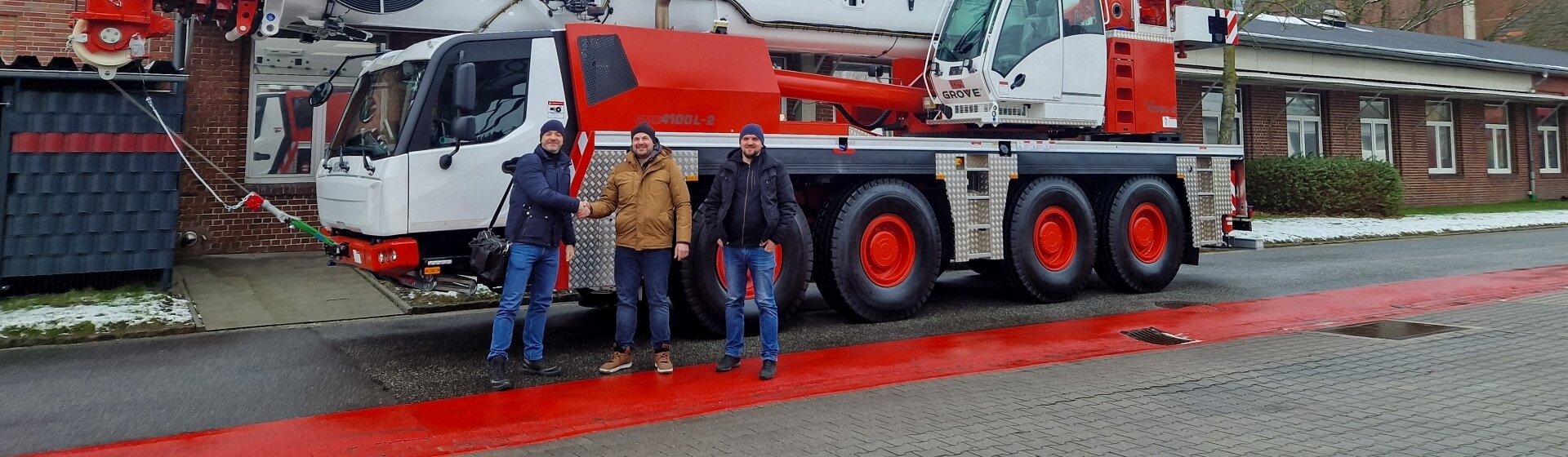 From left to right: Karol Miśkiewicz (owner of Karmax); Marcin Mazurkiewicz (Zeppelin Polska); Sylwester Modrzejewski (Karmax). Polish-crane-rental-company-Karmax-adds-Grove-GMK4100L-2-01.jpg