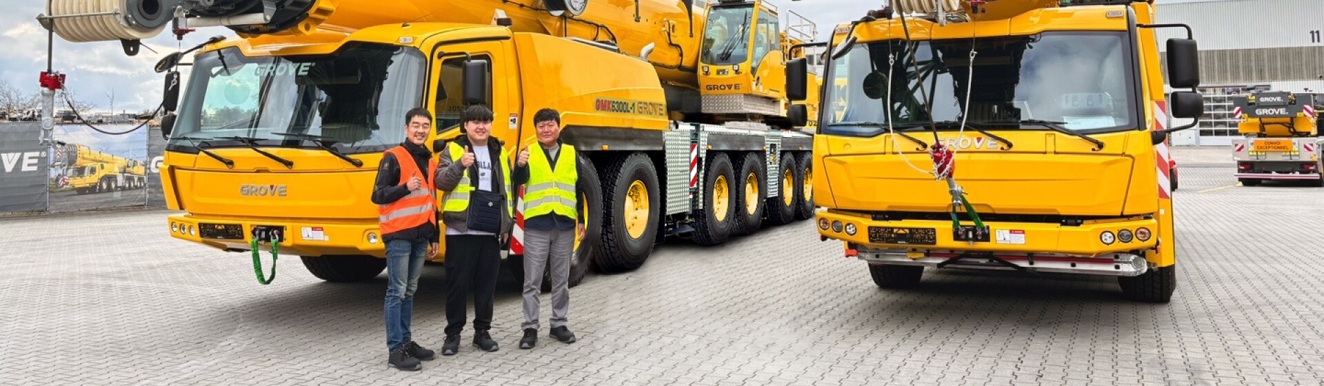 Taking a tour of the Manitowoc factory in Wilhelmshaven, Germany. From left to right: Roy Lim, Manitowoc; Dong-un Yeom, Lee-Gang; Hyeon- Beom Yeom, Lee-Gang. South-Koreas-Lee-Gang-adds-a-Grove-GMK5250XL-1-to-the-fleet.jpg