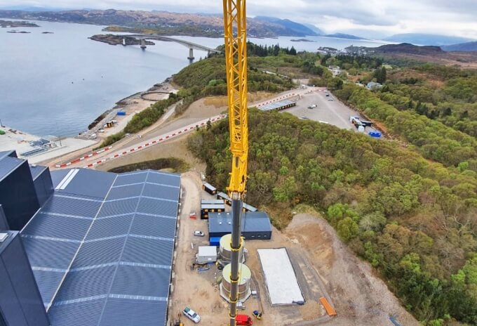 Using a 70 m main boom and 21 m bi-fold swingaway jib, Stoddart’s GMK5250L carries out roof repairs within an 80 m radius to buildings in Kyle of Lochalsh on the Isle of Skye in Scotland. Grove-GMK5250L-navigates-tight-roads-and-hills-with-ease-for-Highlands-based-Stoddart-Crane-Hire-2.jpg