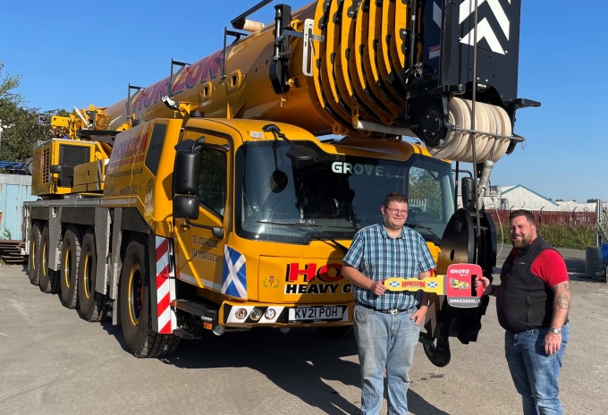 James Leishman, sales manager at Manitowoc UK, presents a ceremonial handover key to Stewart Dougall, director of Horizon Reinforcing & Crane Hire. MTW-News--Scotlands-first-Grove-GMK5250XL-1-goes-to-Horizon-Reinforcing-Crane-Hire2.jpg