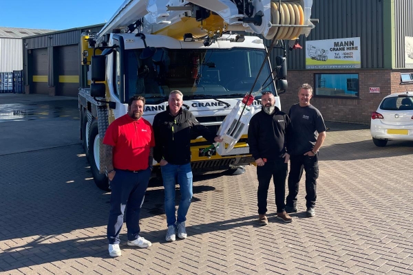 Left to right: Jim Leishman, Manitowoc; Chris Barnes, Mann Crane Hire; Dave Grayson, Manitowoc; Steve Clark, Mann Crane Hire. Grove-delivers-new-GMK3050-3-to-Mann-Crane-Hire-at-Vertikal-Days-2025-01.jpg