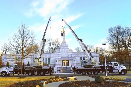 Northland-Crane-Service-delivers-a-heavenly-lift-with-twin-National-Crane-NBT60XL-boom-trucks.jpg