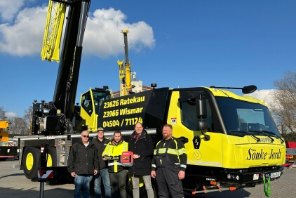Celebrating the handover of the new crane. Left to right: Company owner Sӧnke Jordt, Paul Stender, and Tim Jordt, with Holger Haber of Manitowoc, and John Klebs from Sӧnke Jordt. Compact-roadable-ready-Grove-GMK4080L-gives-Sonke-Jordt-taxi-crane-flexibility-01.jpg